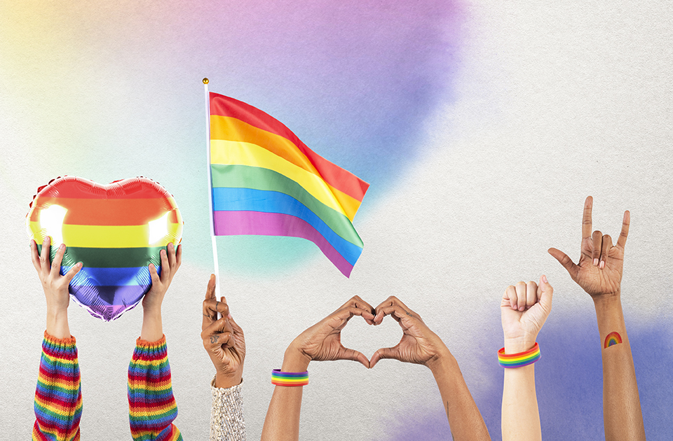 LGBTQ+ pride celebration with hand and crowd cheering remixed media